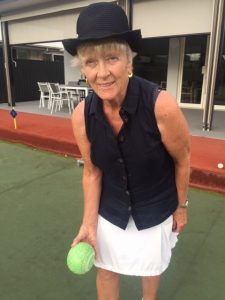 Close up of Giselle playing bowls