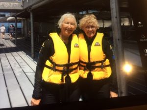 Giselle with friend in life jackets outside of boat before snorkelling at the Great Barrier Reef