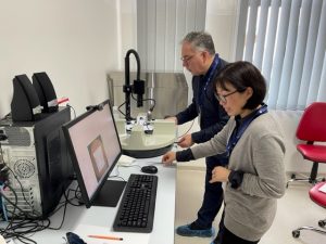 Dr. Suzuki and Professor Mark Radford preparing the machine for measurements at UMFST